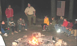 scouts around campfire